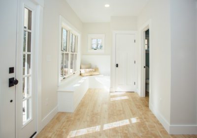 Sunny foyer, New Hampshire, "Modern Cottage," Custom home design and construction by Don Madore. New England home builders.